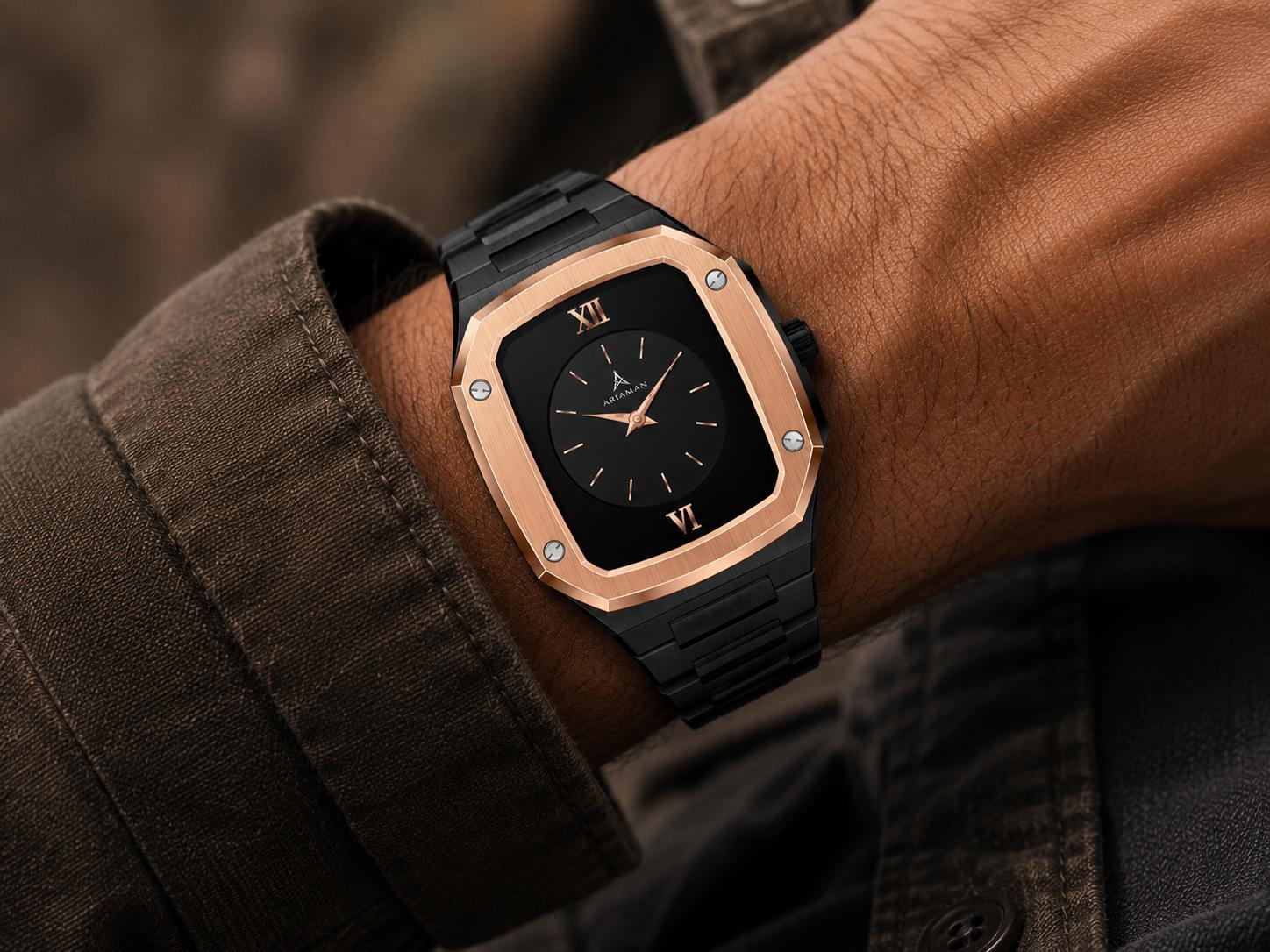 A classic Ariaman & Co watch with a leather strap resting on a dark, textured surface.